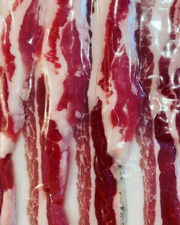 Our popular GM Free Berkshire Dry Cured Streaky Bacon